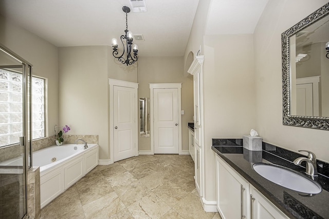 1239 W 22nd St Unit C, Houston, TX 77008 - bathroom with vanity, a whirlpool tub, a stall shower, and a chandelier