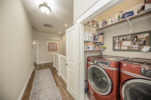 1239 W 22nd St Unit C, Houston, TX 77008 - laundry area featuring attic access, independent washer and dryer, wood finished floors, and baseboards