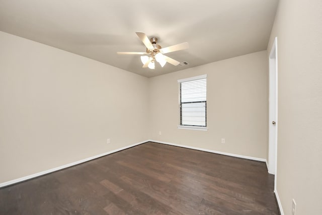 5627 Darling, Houston, TX 77007 - spare room with ceiling fan, baseboards, and dark wood finished floors