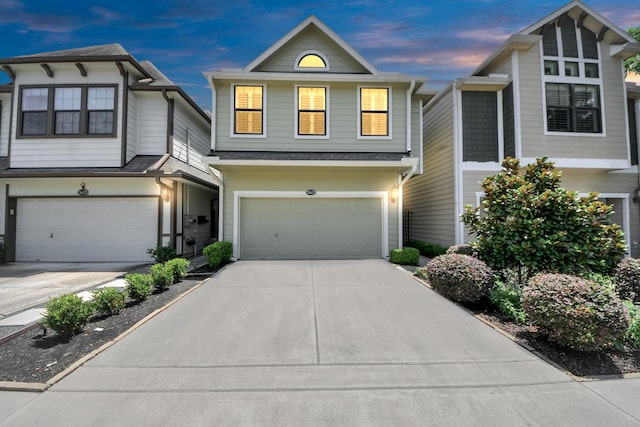 5627 Darling St, Houston, TX 77007 - view of front of property featuring an attached garage, driveway, and a shingled roof