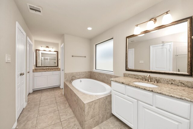 5627 Darling, Houston, TX 77007 - full bath featuring two vanities, a garden tub, and tile patterned flooring
