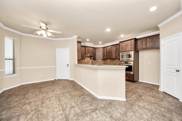 5627 Darling, Houston, TX 77007 - kitchen with stainless steel appliances, ceiling fan, light countertops, a peninsula, and decorative backsplash