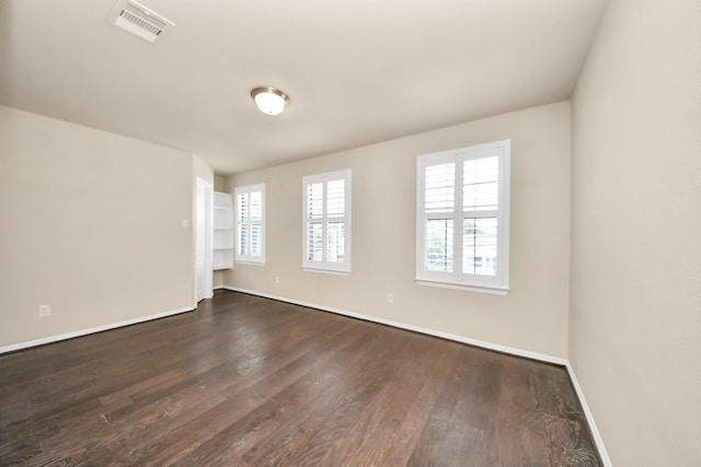 5627 Darling, Houston, TX 77007 - spare room with dark wood-style flooring, baseboards, and plenty of natural light