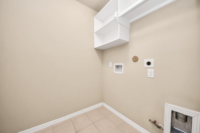 5627 Darling, Houston, TX 77007 - washroom with gas dryer hookup, washer hookup, baseboards, light tile patterned floors, and electric dryer hookup