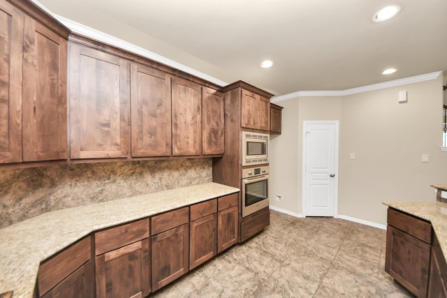 5627 Darling St, Houston, TX 77007 - kitchen with appliances with stainless steel finishes, crown molding, recessed lighting, baseboards, and tasteful backsplash