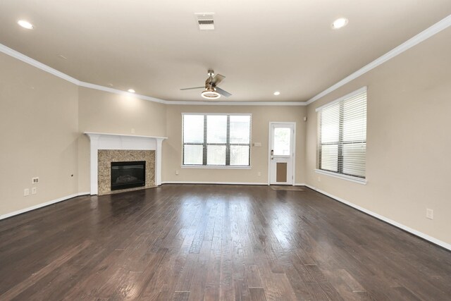 5627 Darling, Houston, TX 77007 - unfurnished living room featuring a ceiling fan, dark wood finished floors, crown molding, baseboards, and a premium fireplace