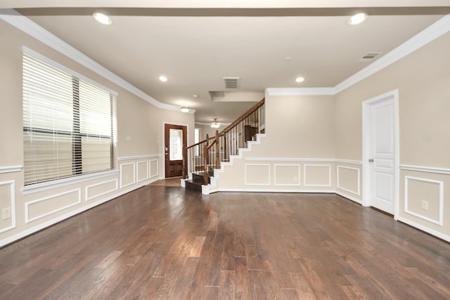 5627 Darling St, Houston, TX 77007 - foyer entrance with a decorative wall, ornamental molding, stairway, wood finished floors, and ceiling fan