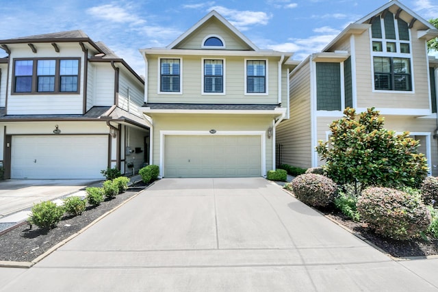 5627 Darling, Houston, TX 77007 - view of front of house featuring a garage, concrete driveway, and a shingled roof