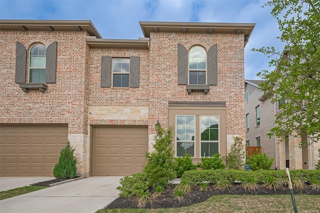 11251 Buchanan Coves Ln, Cypress, TX 77433 - view of front of property featuring concrete driveway, brick siding, and an attached garage