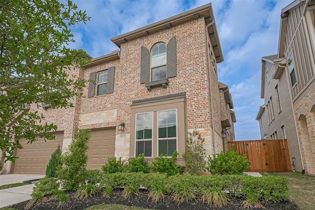 11251 Buchanan Coves Ln, Cypress, TX 77433 - view of front of house featuring brick siding, stone siding, an attached garage, and driveway