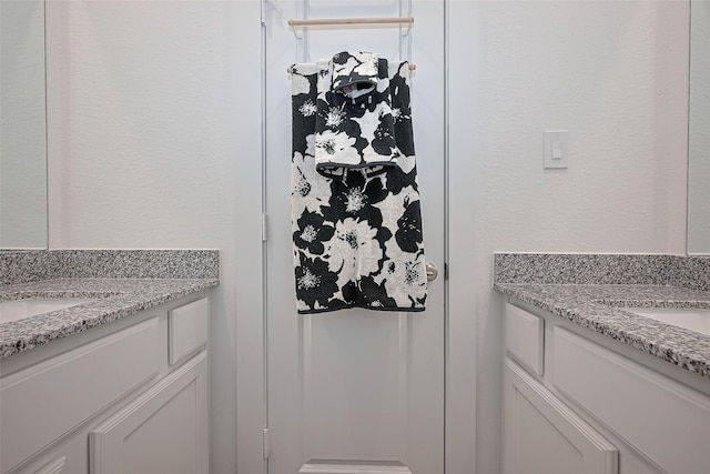 11251 Buchanan Coves Ln, Cypress, TX 77433 - bathroom featuring vanity and a textured wall