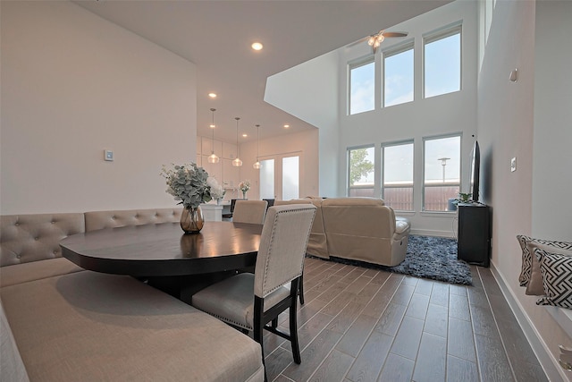 11251 Buchanan Coves Ln, Cypress, TX 77433 - dining area with wood finished floors, baseboards, and recessed lighting