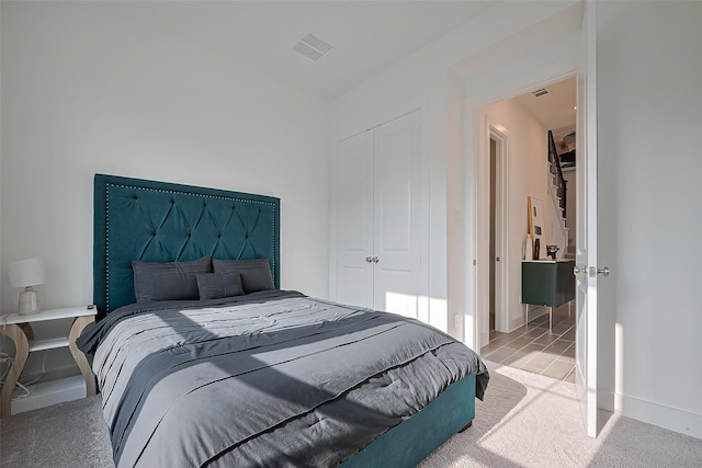 11251 Buchanan Coves Ln, Cypress, TX 77433 - bedroom featuring a closet and light carpet