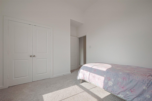 11251 Buchanan Coves Ln, Cypress, TX 77433 - bedroom featuring light colored carpet, a closet, and baseboards