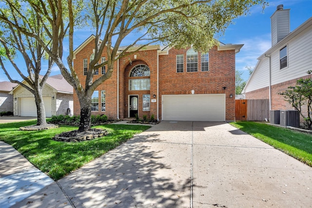 7818 Desert Canyon Ct, Houston, TX 77041 - traditional-style home featuring brick siding, driveway, an attached garage, central AC, and a gate