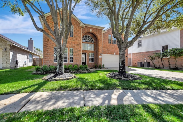 7818 Desert Canyon Ct, Houston, TX 77041 - traditional-style home with an attached garage, brick siding, driveway, and a front lawn