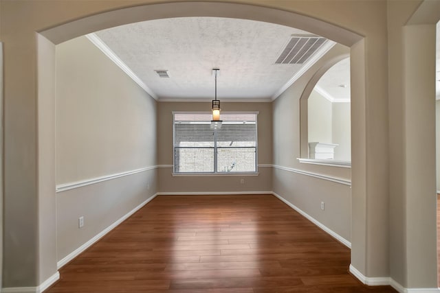 7818 Desert Canyon Ct, Houston, TX 77041 - spare room featuring wood finished floors, crown molding, baseboards, arched walkways, and a textured ceiling