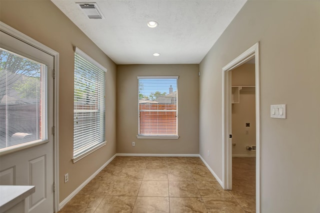 7818 Desert Canyon Ct, Houston, TX 77041 - unfurnished room featuring baseboards, light tile patterned floors, recessed lighting, and a textured ceiling