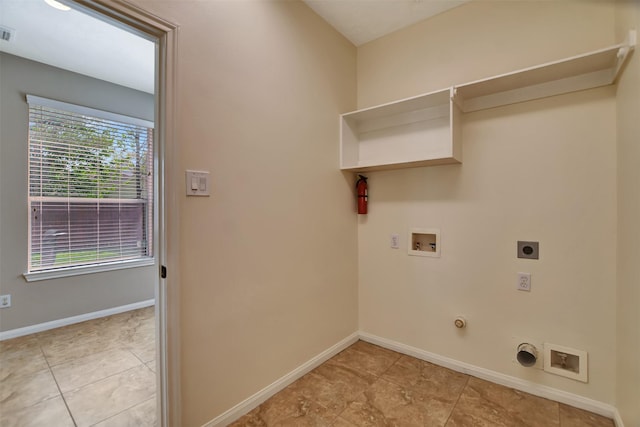 7818 Desert Canyon Ct, Houston, TX 77041 - laundry area featuring hookup for an electric dryer, washer hookup, hookup for a gas dryer, and baseboards