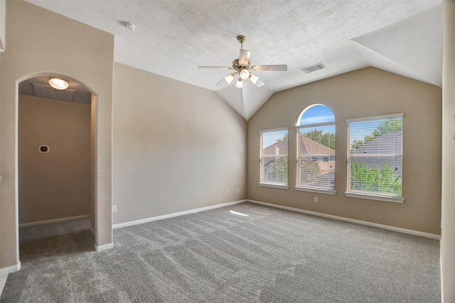 7818 Desert Canyon Ct, Houston, TX 77041 - carpeted empty room featuring ceiling fan, lofted ceiling, arched walkways, a smoke detector, and baseboards