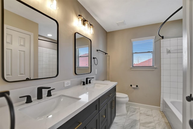 7818 Desert Canyon Ct, Houston, TX 77041 - bathroom featuring double vanity, bathtub / shower combination, toilet, marble finish flooring, and baseboards