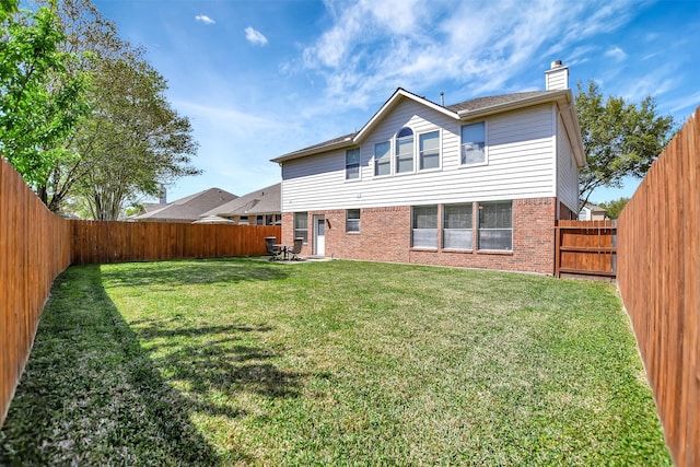 7818 Desert Canyon Ct, Houston, TX 77041 - rear view of house with a chimney and brick siding
