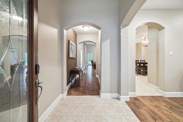 18411 S Raven Shore Dr, Cypress, TX 77433 - entryway featuring arched walkways and wood finished floors
