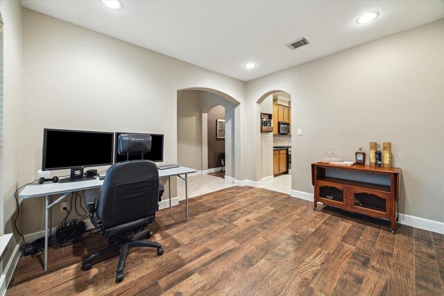 18411 S Raven Shore Dr, Cypress, TX 77433 - office space featuring arched walkways, wood finished floors, and recessed lighting