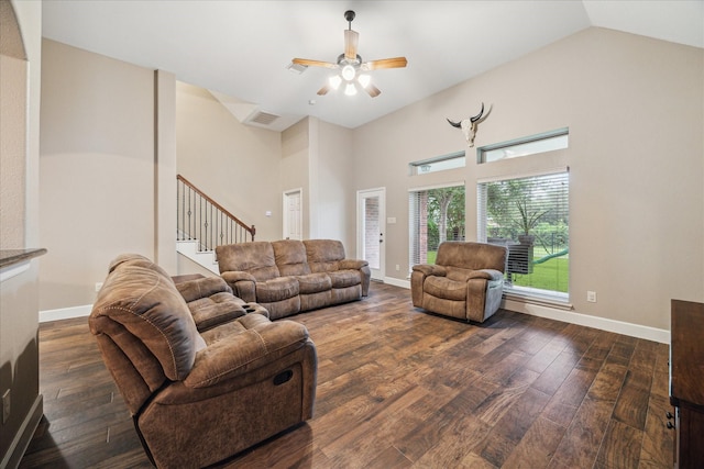 18411 S Raven Shore Dr, Cypress, TX 77433 - living area with dark wood-style floors, stairs, a ceiling fan, and high vaulted ceiling