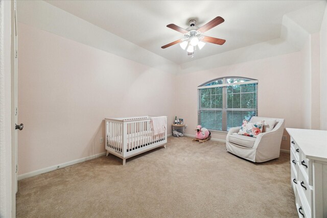18411 S Raven Shore Dr, Cypress, TX 77433 - bedroom with light carpet, a nursery area, and a ceiling fan