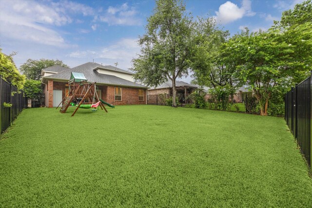 18411 S Raven Shore Dr, Cypress, TX 77433 - fenced backyard with a playground