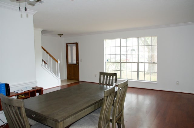 20502 Big Wells Dr, Katy, TX 77449 - dining space with ornamental molding, wood finished floors, and stairway