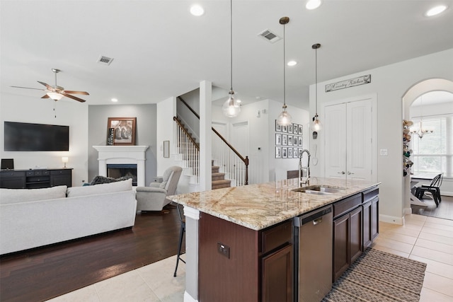 2114 Holly Manor Ct, Katy, TX 77493 - kitchen featuring dishwasher, a sink, ceiling fan, light tile patterned flooring, and recessed lighting