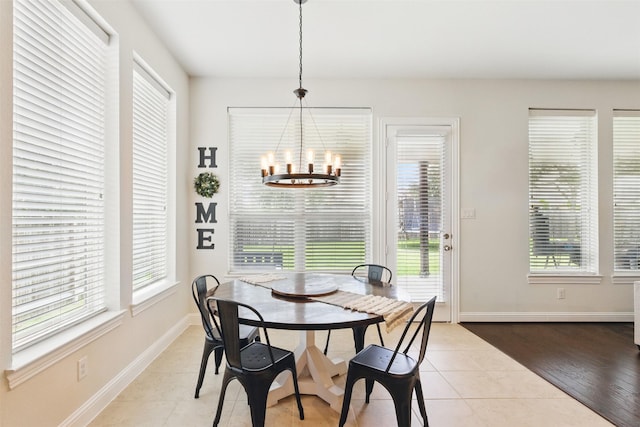 2114 Holly Manor Ct, Katy, TX 77493 - tiled dining space with a chandelier, healthy amount of natural light, baseboards, and breakfast area