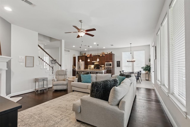 2114 Holly Manor Ct, Katy, TX 77493 - living room featuring ceiling fan, dark wood-style floors, baseboards, stairway, and recessed lighting