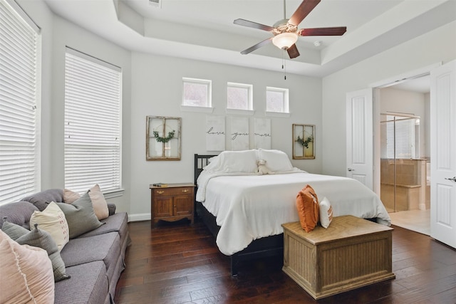 2114 Holly Manor Ct, Katy, TX 77493 - bedroom with dark wood finished floors, a raised ceiling, and ceiling fan