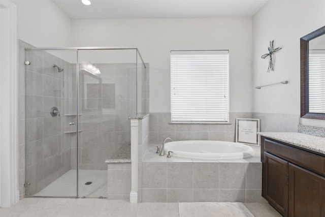 2114 Holly Manor Ct, Katy, TX 77493 - full bathroom featuring vanity, a bath, a stall shower, and tile patterned floors
