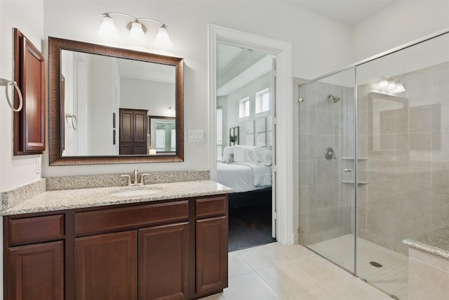 2114 Holly Manor Ct, Katy, TX 77493 - full bathroom with connected bathroom, a stall shower, vanity, and tile patterned flooring