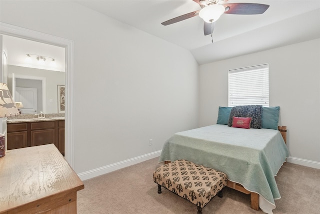 2114 Holly Manor Ct, Katy, TX 77493 - bedroom with light colored carpet, baseboards, ensuite bath, lofted ceiling, and a ceiling fan