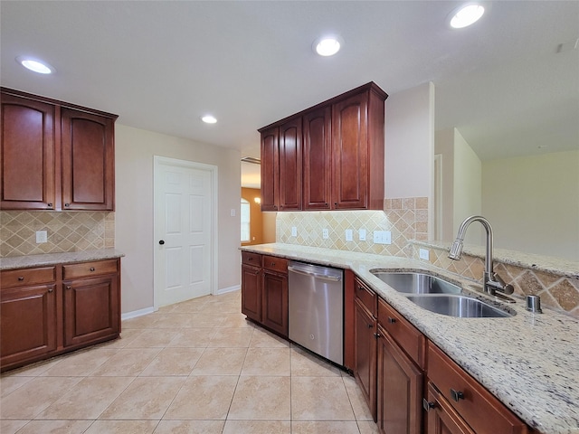 21123 Amber Crossing Dr, Richmond, TX 77406 - kitchen featuring dishwasher, a sink, light stone counters, light tile patterned flooring, and backsplash