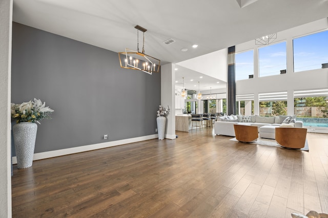 27927 Indigo Ridge Dr, Fulshear, TX 77441 - living area with a chandelier, wood finished floors, baseboards, and recessed lighting