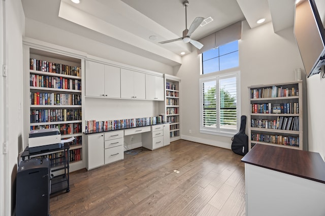 27927 Indigo Ridge Dr, Fulshear, TX 77441 - home office with a ceiling fan, wood finished floors, a towering ceiling, recessed lighting, and baseboards