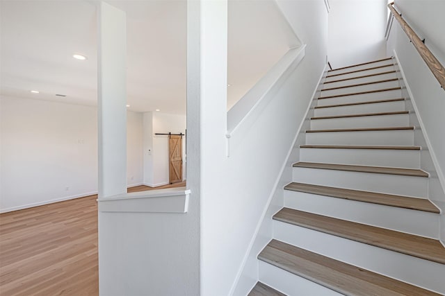 2320 Mills St, Houston, TX 77026 - stairway with wood finished floors, recessed lighting, and baseboards