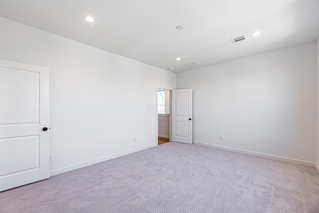 2320 Mills St, Houston, TX 77026 - carpeted empty room with recessed lighting and baseboards