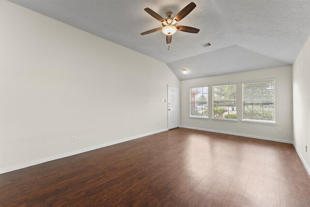 2611 Verano Dr, Richmond, TX 77406 - empty room featuring ceiling fan, lofted ceiling, dark wood-style floors, and baseboards