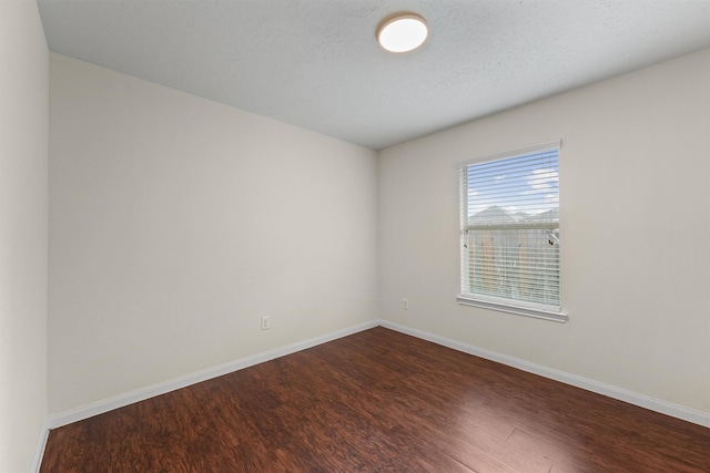 2611 Verano Dr, Richmond, TX 77406 - unfurnished room featuring dark wood-style flooring and baseboards
