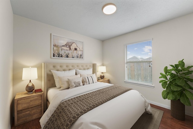 2611 Verano Dr, Richmond, TX 77406 - bedroom featuring baseboards and wood finished floors
