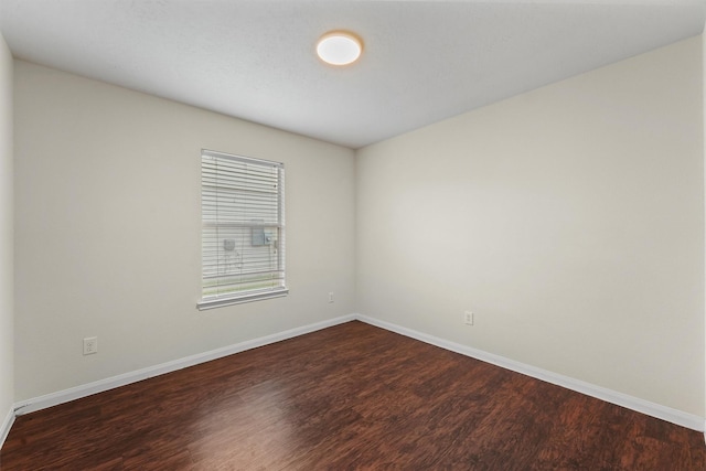 2611 Verano Dr, Richmond, TX 77406 - empty room featuring dark wood finished floors and baseboards
