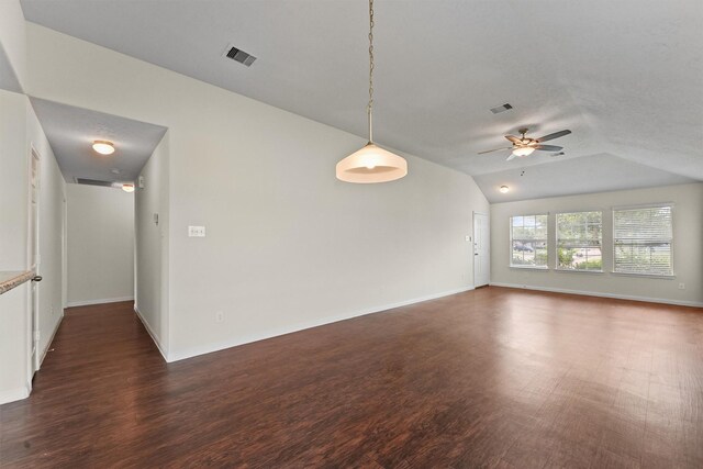 2611 Verano Dr, Richmond, TX 77406 - unfurnished room featuring dark wood-type flooring, a ceiling fan, vaulted ceiling, and baseboards
