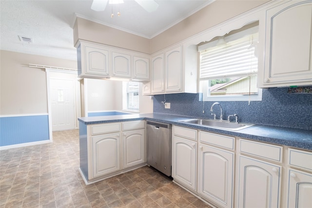 228 Hickory St, Huntsville, TX 77320 - kitchen featuring stainless steel dishwasher, a sink, dark countertops, a peninsula, and ornamental molding
